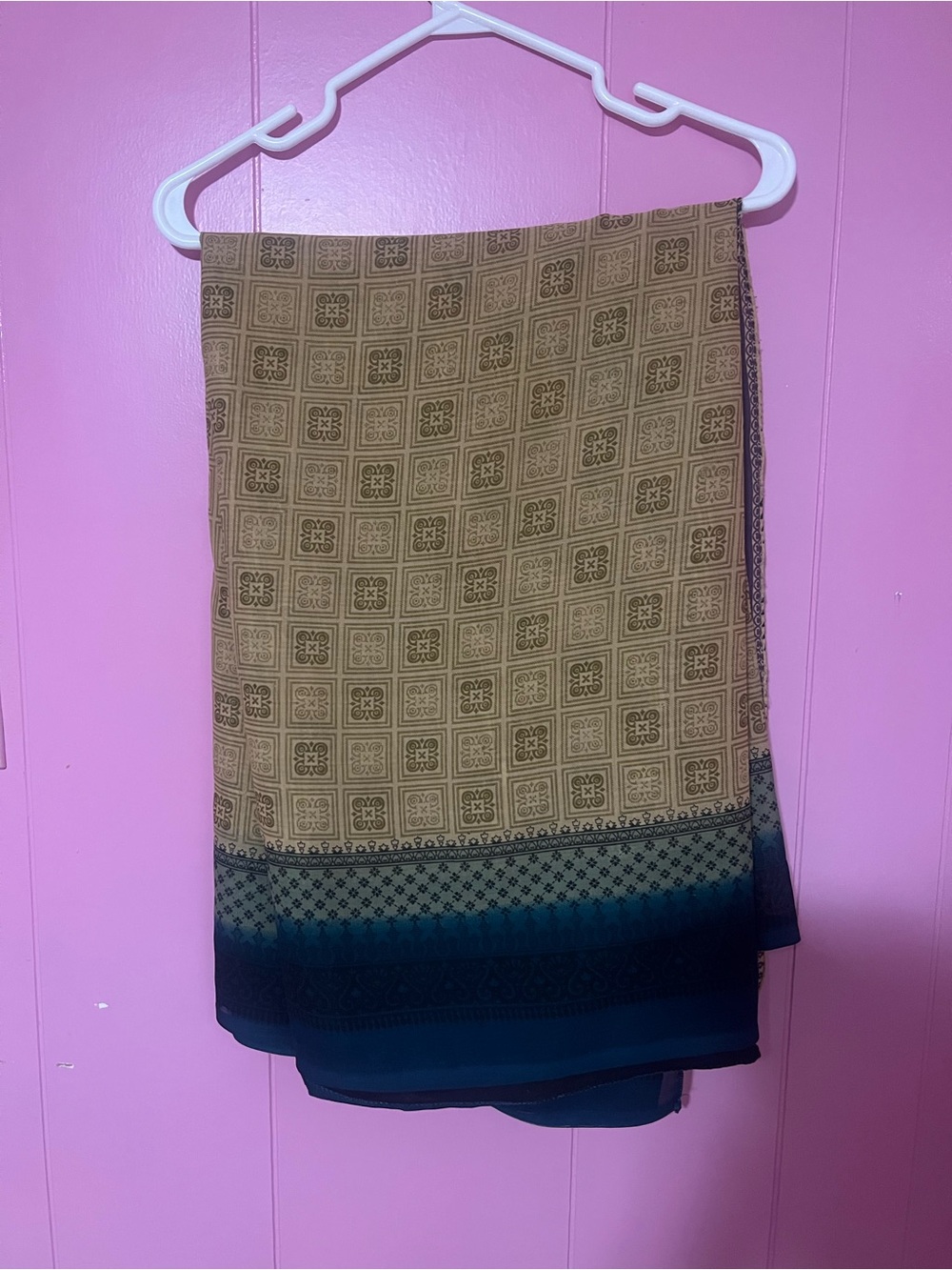 Beige with jade like dark blue border saree